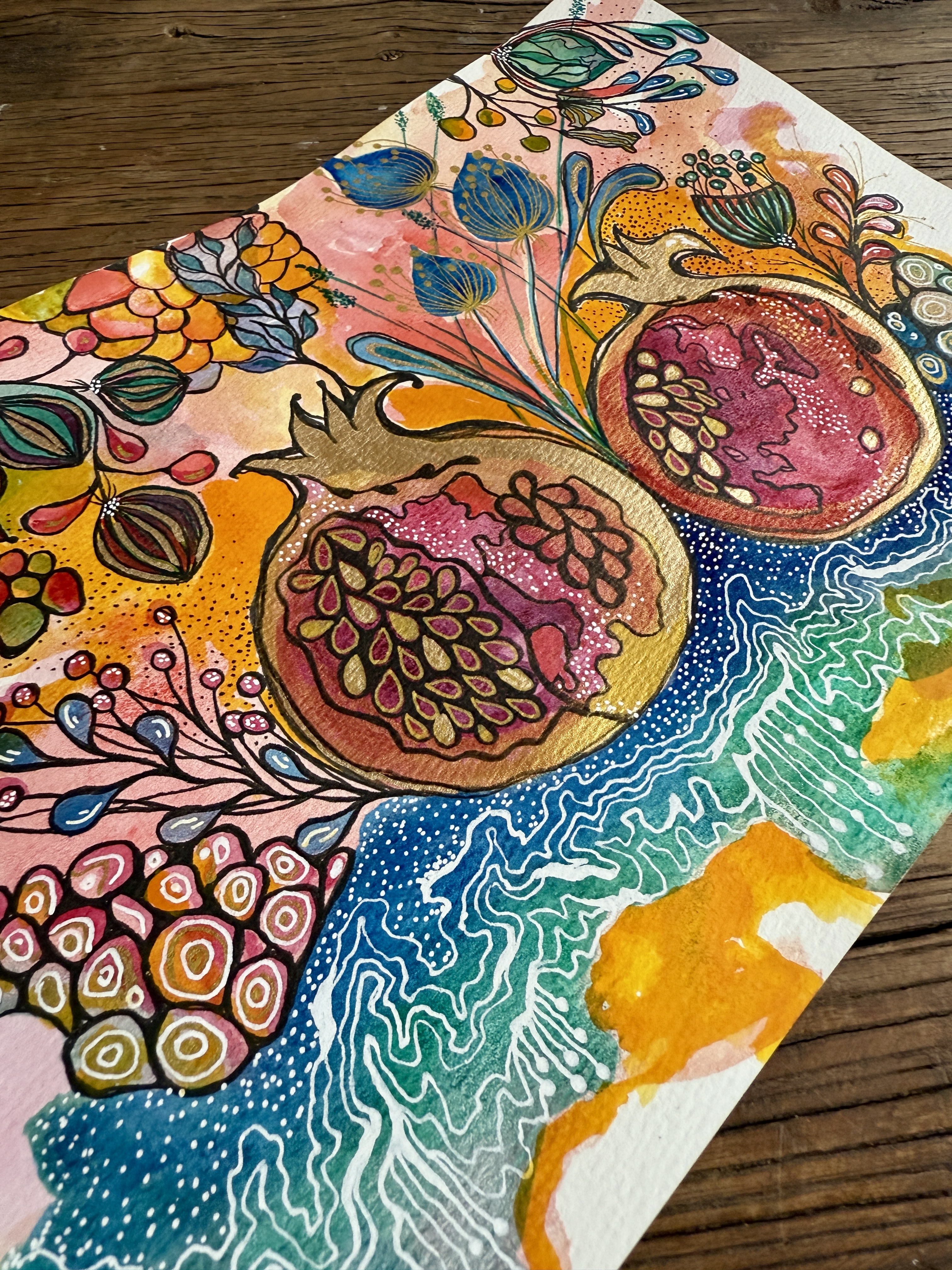 Gilded pomegranate watercolor with gold and white linework