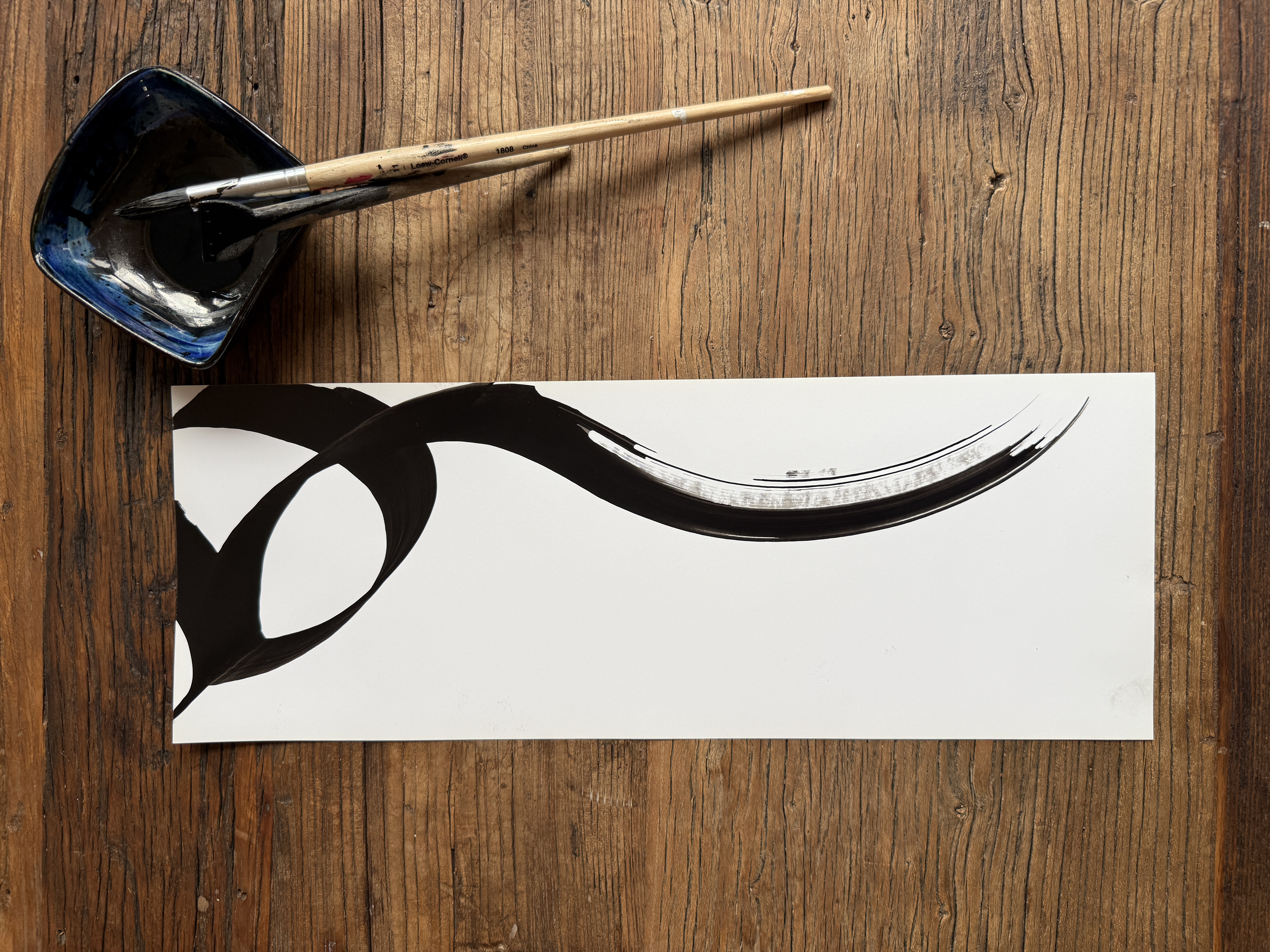 Single black brushstroke calligraphy